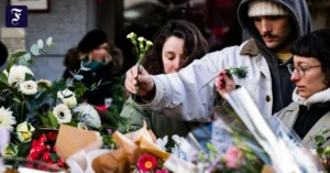 menschen-legen-nach-dem-brand.webp.webp