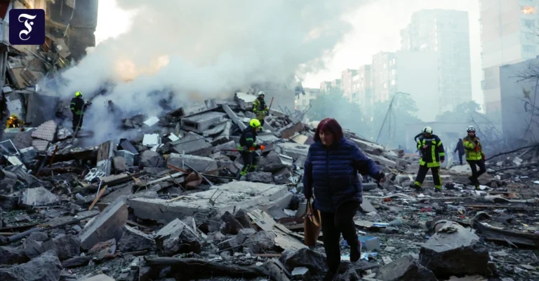 a-woman-walks-amid-rubble-as.webp.webp