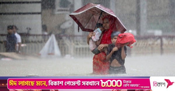p1_story_people_wade_through_the_water_as_they_look_for_shelter_during_a_flood_amidst_heavy_rains_th.jpeg