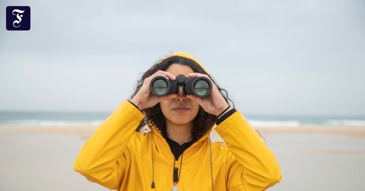 woman-using-binoculars-while.webp.webp
